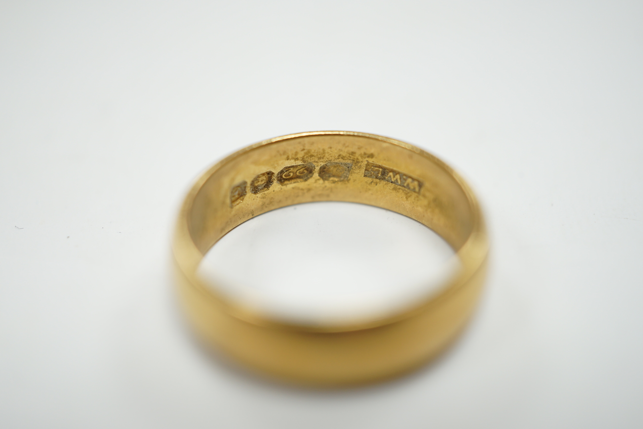A 1960's 22ct gold wedding band, size M, 6 grams.
